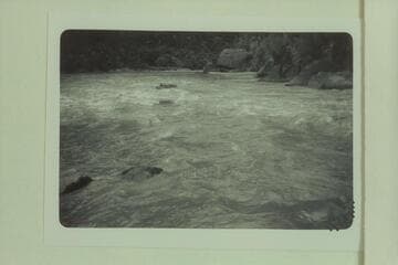 Bill Davis pulling out below Triplett Rapid.  Photo from left bank