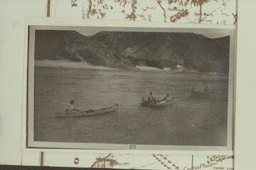 Motorboat towing the "Tapeats" and the canoe at Middle Black Canyon Damsite.  Probably a LaRue photo during the cruise from Pierce Ferry to Needles