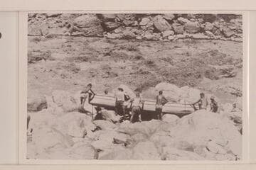 Portaging the "Coronado" at Vulcan Rapid.  Adger wears the striped shirt.  Bartl is at the bow
