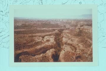 Down from near the head of Stevens Creek; Navajo Mountain on the skyline, 50 Mile Mountain at right