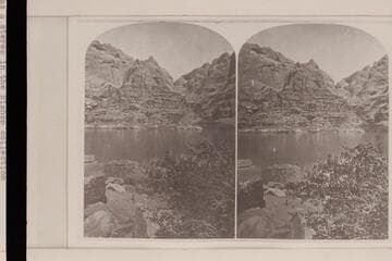 The gulch on the right bank of Glen Canyon that became Hole-in-the-Rock when the Mormons crossed at this point.  [From] stereo captioned Views on the Colorado River--River Bank, No. 163
