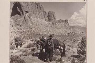 Arch in the Sky; Bahe and White-hat load the packs