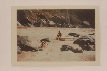 Lining a Nevills sadiron at Vulcan Rapid.  Garth Marston is in the river.  Nevills sits on the deck