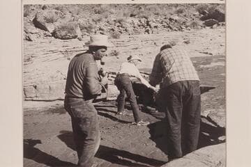 Nancy Daly poses for pictures in the creek near White-hat Bridge.  Bill Belknap and Jorgen Visbak