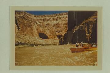Jack Brennan handling his glass outboard boat with the oars.  Mile 47.  Triple Alcoves