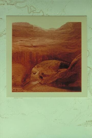 Gregory Natural Bridge, Soda Gulch, Escalante River; downstream view.  Figure on ledge to right of stream is Kent Frost