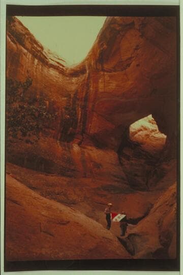 Ba-Sah Bridge.  Marston and Masland holding Explorers Club flag