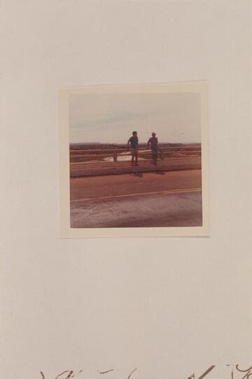 Nate and Jim Jordan at the rail of the new highway bridge at Cameron.  The Little Colorado is running mud