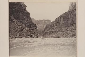 Nevills carrying Margaret Garthwaite Marston as passenger through North Canyon Rapid.  Kent Frost runs close behind.  Mile 20 1/2 in Marble Canyon.  Lees Ferry gauge:  36,100 cfs