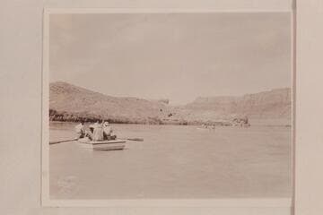Three of the four Nevills boats leaving Lees Ferry for a traverse of the Grand Canyon. Nevills is oarsman at the right. Frost is oarsman of the second boat. Garth Marston is oarsman of the boat in the foreground