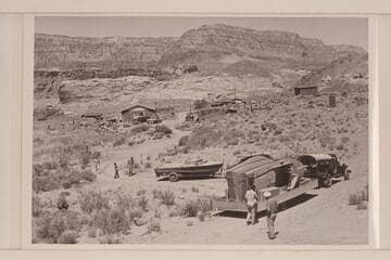 Boats and motors arriving at Lees Ferry for the start of the Marble-Grand Canyon traverse.  The buildings in the background are those in use by the USGS for the river gauging