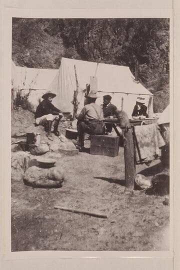 Dining at Rusts Camp on Bright Angel Creek.  Israel [Chamberlain] has back to camera; guide at left