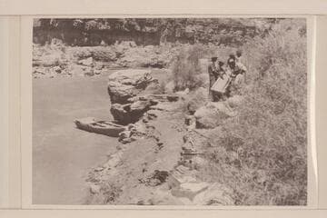 Repairing boat after accident; Rapids; splitting boat.  14 M. below Honaker Trail