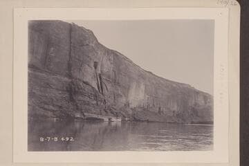 Near upper end of Glen Canyon.  The formation is now known as Tapestry Wall due to the weathering.  Mile 136