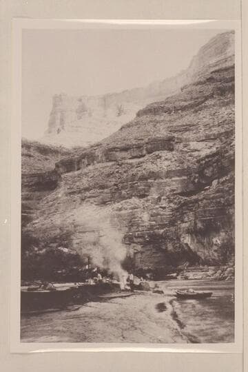 Camp in San Juan Canyon near mouth of Johns Canyon.  Lower part of wall formed by Goodridge formation and upper part by Moonlight sandstone and Hermit Shale.  Johns Canyon--Mile 82.3