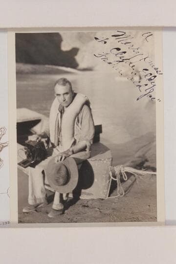 Clyde Eddy at the noon stop below Monument Creek Rapid [A Merry Xmas to Clyde Eddy from 'Old Joe']