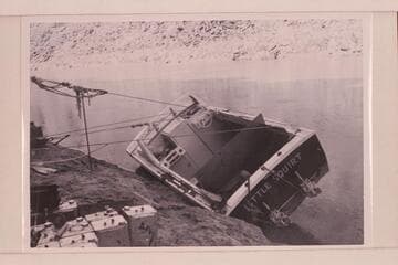 The twin jet "Little Squirt" rolled at Mile 4 for repairs. After temporary repairs the trip was abandoned and a new start made June 18. This boat became known as the "Big Red." It completed the run through the Grand Canyon in June