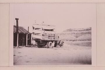 The three Nevills' sadirons on truck ready to start for Green River, Wyoming.  In front of Nevills' residence at Mexican Hat
