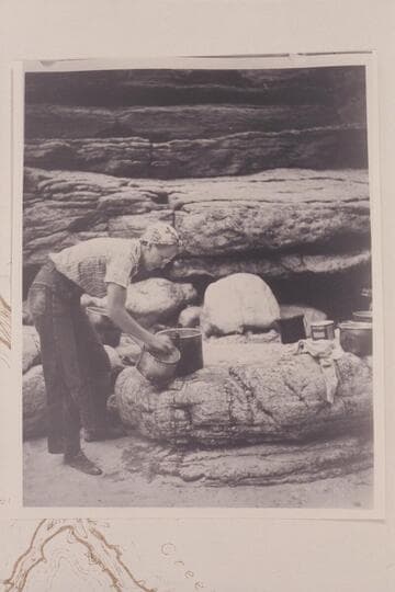 Millie Baker scrubbing pots at camp at Supai