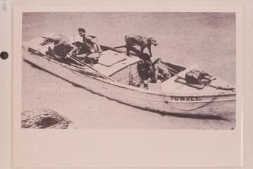 The "Powell" at the start-off, showing our mascot "Rags."  The boat of the Eddy fleet which was lost in Dubendorff Rapid.  This was one of the heavy boats copied after the archaic designs of Powell