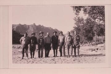 USGS crew at McPherson Ranch above Greenriver, Utah.  Clogston, Reeside, Loper, Stoner, Lint, Trimble, Woolley, Blake.  McPherson Ranch.  Note that four of the crew are wearing the dangerous choke-bored breeches