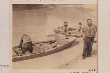 Frazier and the three remaining skiffs of The Dusty Dozen below Vulcan Rapid.After portaging the skiffs at Vulcan Rapid, Frazier dropped overboard in the riffle at Mile 179.7 and the party beached.  This photo is probably at Mile 180