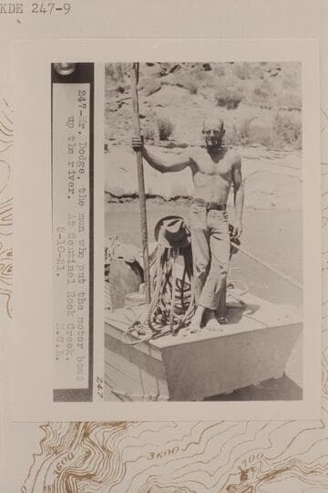 Frank Dodge standing on the bow of the "Navajo" at Sentinel Rock Creek