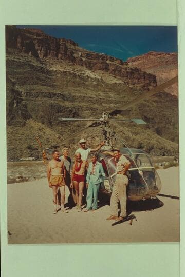 Helicopter and crew on beach at Tapeats Creek.  Left to right:  Taylor, Desloge, Marston, Forcier, Margaret Marston and "Red" Carson