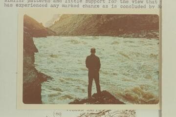 Brick Mortenson sizes up the patterns in Vulcan Rapid.  Brick and David Mortenson et al hiked to the river