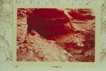 Cave in Tuckup Canyon about one mile upstream from mouth of Cottonwood.  Annie Herrington, 10 years of age, stands in the cave
