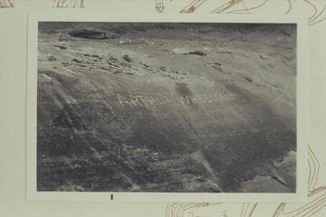 Inscription in cave of White Rim Formation at lower end of Beaver Bototom
