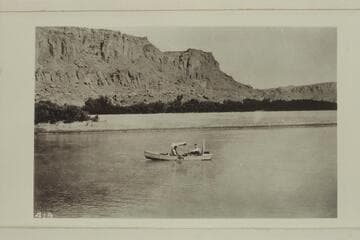 The boat of the LaRue - Richardson - Wimmer Glen Canyon trip of 1915 which traveled from Hite to Lees Ferry between August 25th and 29th. . . .  From the left bank opposite Tickaboo Canyon 23 miles belos Dirty Devils River. . . .  Probably mile 146.8
