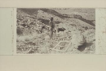 Zahn Camp near mouth of Nokai Canyon.  C. H. Spencer stands by an old makeshift screen