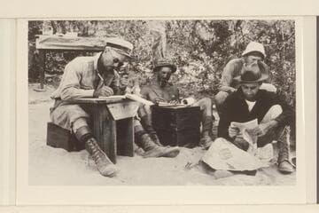 In camp at Diamond Creek.  Left to right:  Moore, LaRue, Stabler, Roger Birdseye.  Boots and breeches worn by Moore are a major hazard