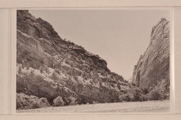 Lower end of Canyon of Lodore at Pats Hole; Echo Cliff on right.  1871, June 28, Steward and Clem had their fracas with a whirlpool along this shore at the left