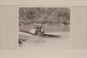 The "Sweet Chariot" cruising on upper Lake Mead in the Grand Canyon at the end of the 1951 motor traverse.  Cooper is pilot.  Taylor facing the camera