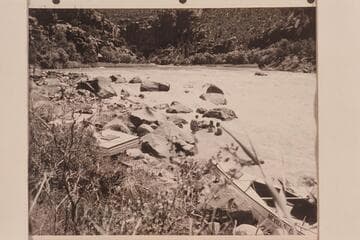 Cooling off in the river after portage of Hells Half Mile.  Al Milotte walks up the rocky shore at left.  Shirley Marston at edge of river behind Willie Taylor.  Loel and Garth Marston are in the water