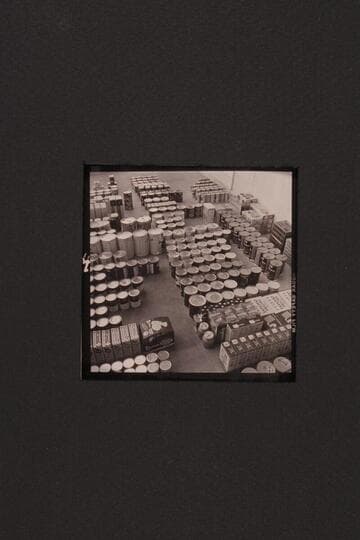 Bill Belknap checks the supplies at Boulder City before taking them to Lees Ferry and other points.  Outboard motor traverse of the Grand Canyon