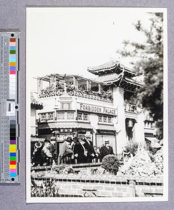 People at the Seven Star Sacred Caverns and wishing well and pool