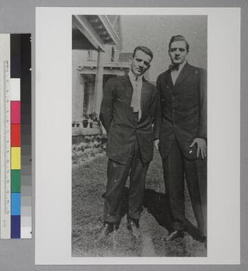 William Hubble and Edwin Powell Hubble standing outside, in front of a porch