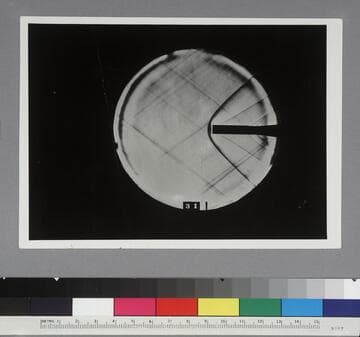 Shadow photograph of wind tunnel test results, showing air stream from a cylindrical model