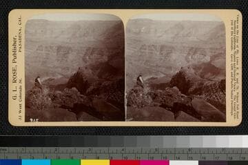 Unidentified man sitting on rock overlooking the Grand Canyon