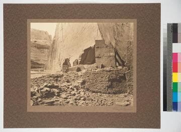 A canyon prehistoric building partly destroyed by falling rock from cliff wall. Del Muerto, Northeast Arizona