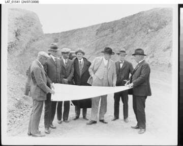 Harry Chandler and others inspect plans for Mulholland Dam