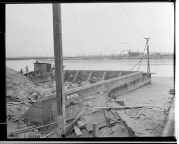 A construction crew working on putting the sheet piling in place for the intake at Long Beach Steam Plant
