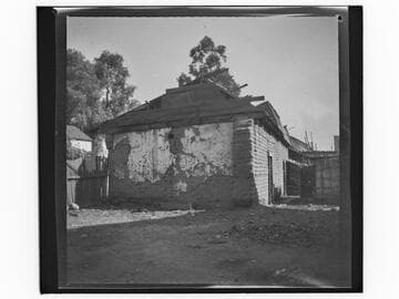 Adobe building with boarded roof