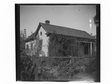 House with oil wells in the background, Los Angeles