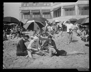 People playing cards on the beach in front of the Casa del Mar Club, Santa Monica
