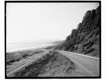 Railroad tracks and Long Wharf in distance along Santa Monica beach, California