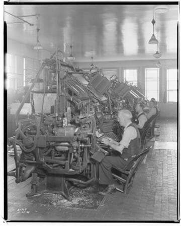 Men typing on Line-o-type machines at the Long Beach Telegram